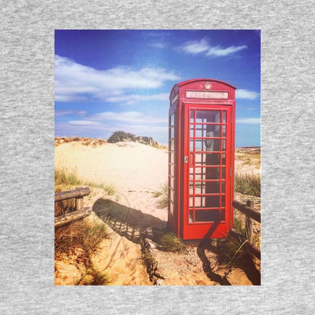 Red phone box on the beach by Lionik09